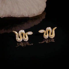 Close-up detail of the sparkling zircons and plating on the Snake Stud Earrings