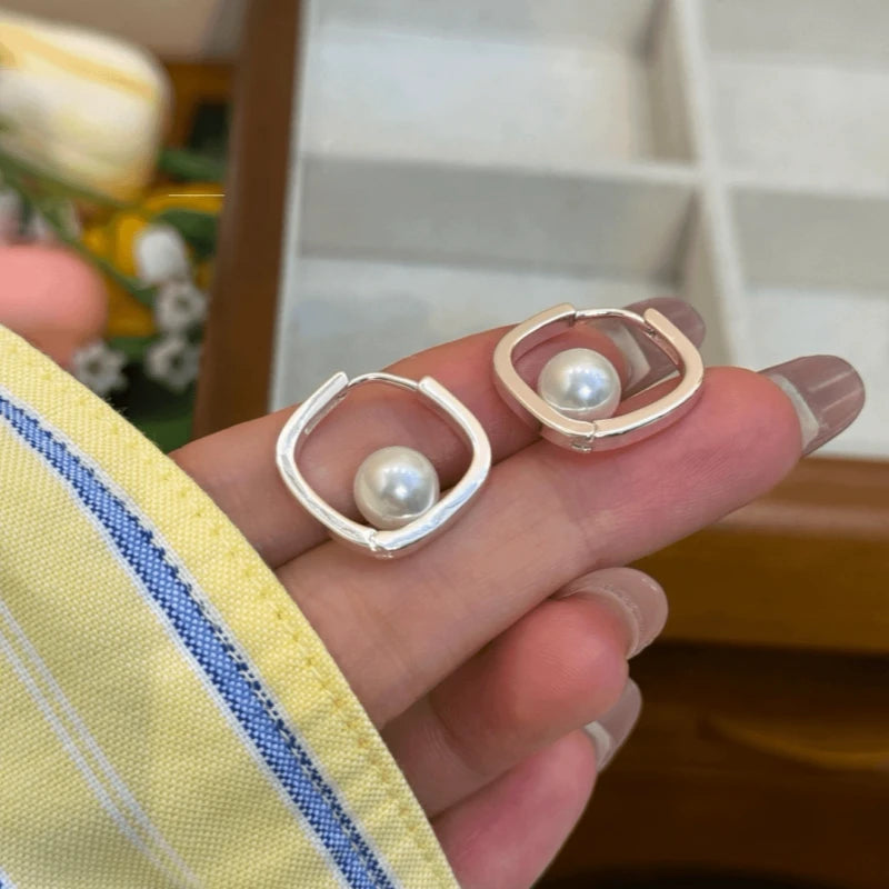 Close-up detail of the sparkling zircons and plating on the Square Bead Hoops