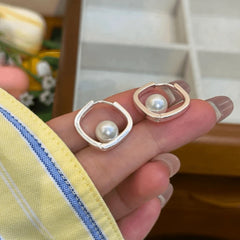 Close-up detail of the sparkling zircons and plating on the Square Bead Hoops