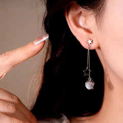 Model showcasing the dangle and style of the 14K Gold-Plated Elegant Star Cat's Eye Bead Tassel Earrings
