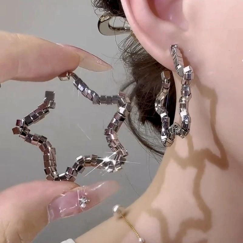 Close-up detail of the sparkling zircons and plating on the Star Threader Earrings