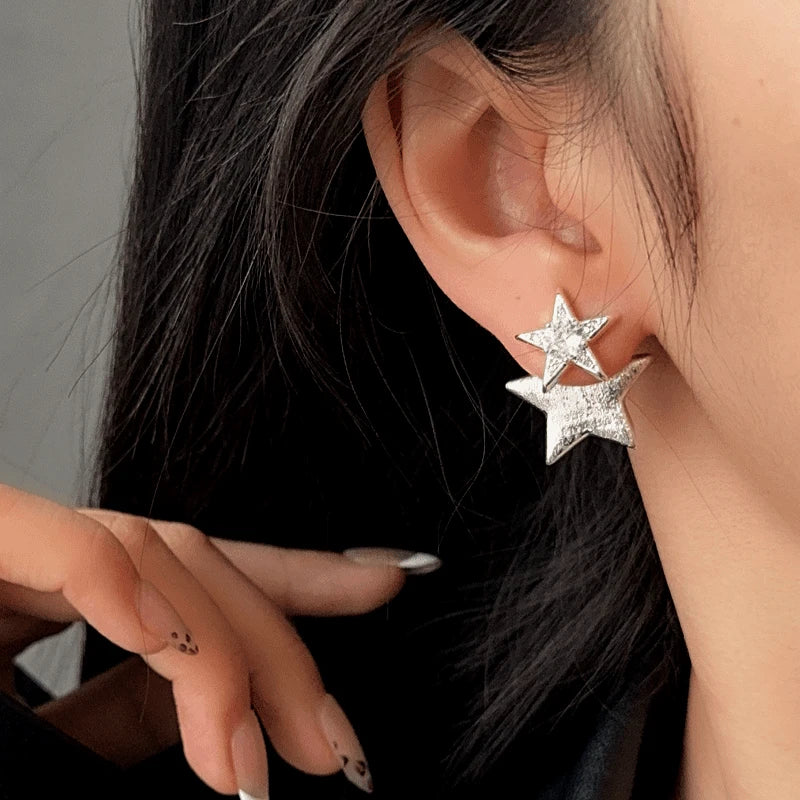 Model showcasing the dangle and style of the 14K Gold-Plated Elegant Star Jacket Earrings