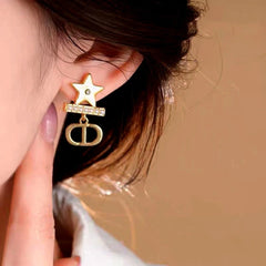 Close-up detail of the sparkling zircons and plating on the Star Pearl Earrings