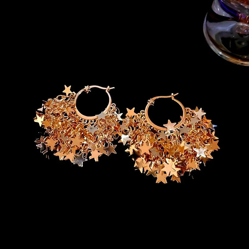 Close-up detail of the sparkling zircons and plating on the Star Tassel Earrings