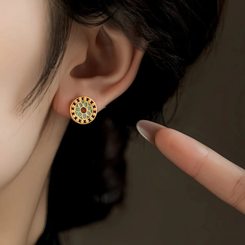 Model showcasing the dangle and style of the 14K Gold-Plated Elegant Studs