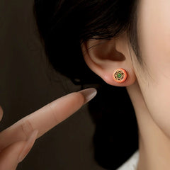 Model showcasing the dangle and style of the 14K Gold-Plated Elegant Studs