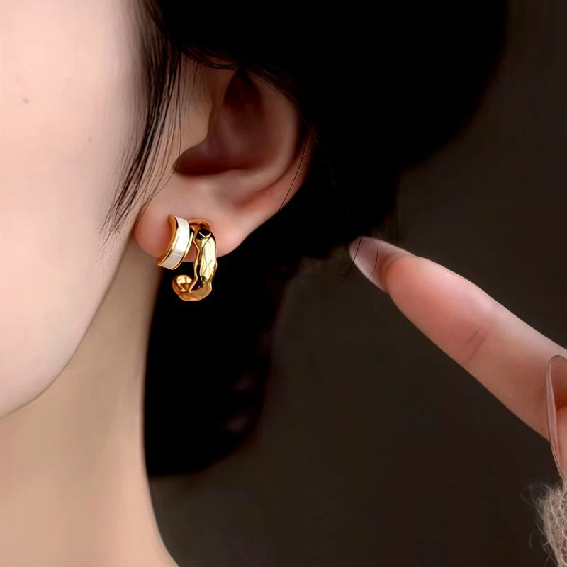 Model showcasing the dangle and style of the 14K Gold-Plated Elegant Studs