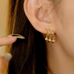 Close-up detail of the sparkling zircons and plating on the Water Drop Earrings