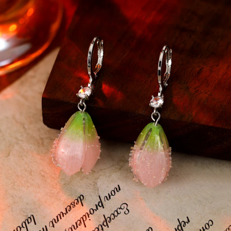 Angled view of the 14K Gold-Plated Elegant Tulip Flower Earrings