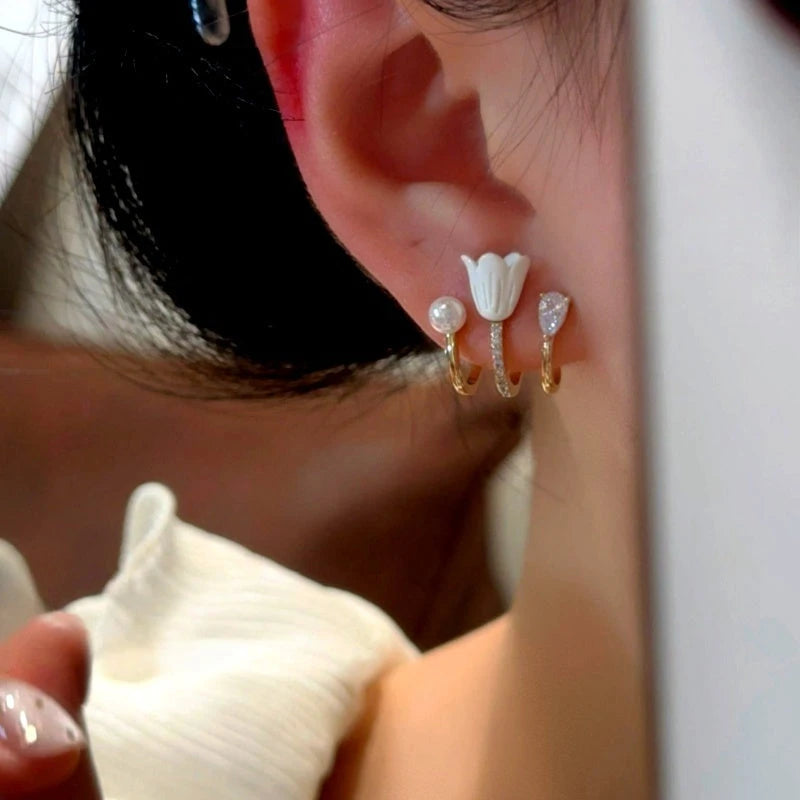 Model showcasing the dangle and style of the 14K Gold-Plated Elegant Tulip Studs