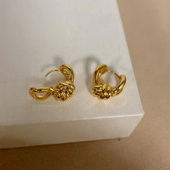 Angled view of the 14K Gold-Plated Elegant Twisted Knotted Earrings
