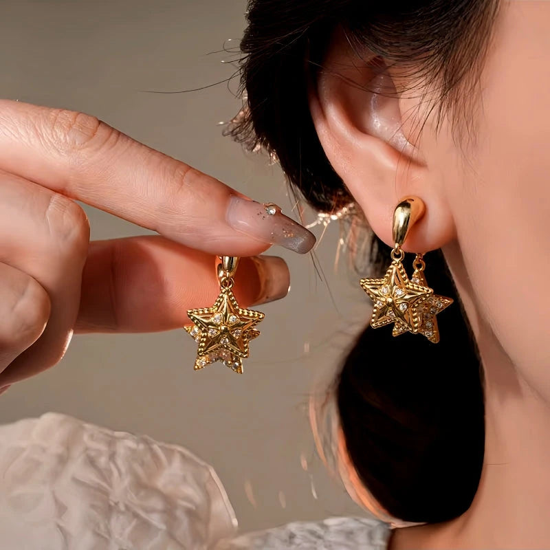 Model showcasing the dangle and style of the 14K Gold-Plated Elegant Two-Piece Multi-Layer Star Earrings