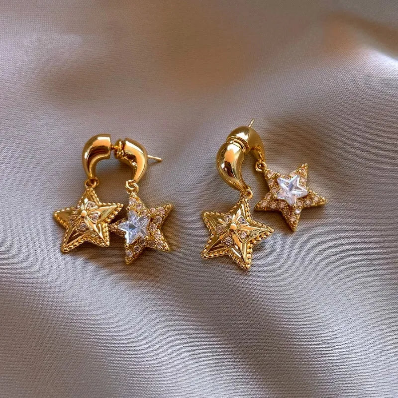 Angled view of the 14K Gold-Plated Elegant Two-Piece Multi-Layer Star Earrings