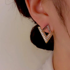 Model showcasing the dangle and style of the 14K Gold-Plated Elegant V Letter Front And Back Earrings