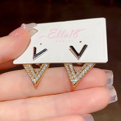 Close-up detail of the sparkling zircons and plating on the V Letter Earrings