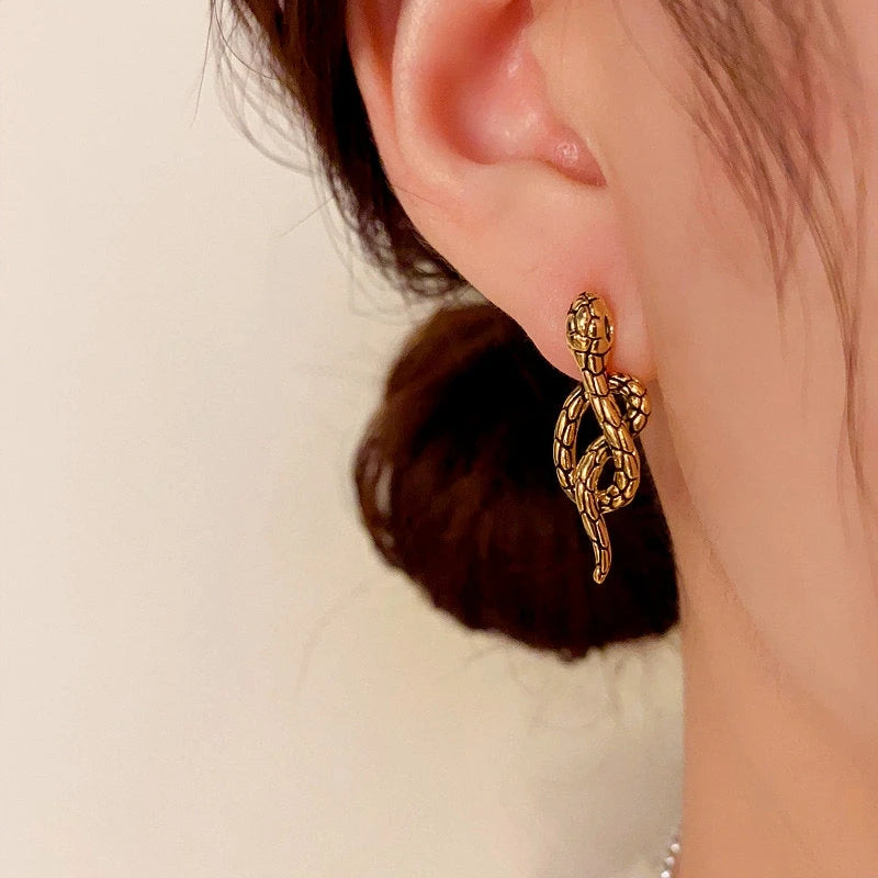 Close-up detail of the sparkling zircons and plating on the Black Snake Earrings