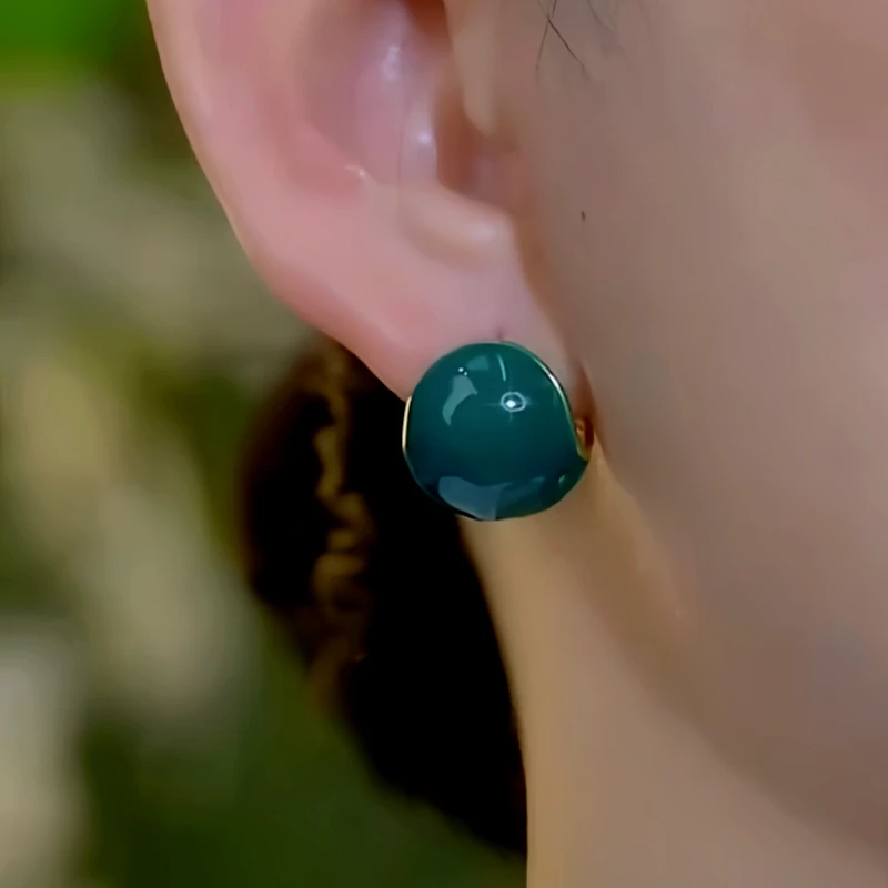 Model showcasing the dangle and style of the 14K Gold-Plated Elegant Water Drop Earrings