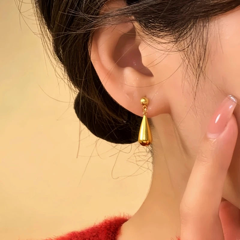 Close-up detail of the sparkling zircons and plating on the Gold Water Drop Earrings