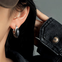 Close-up detail of the sparkling zircons and plating on the Black Water Drop Earrings
