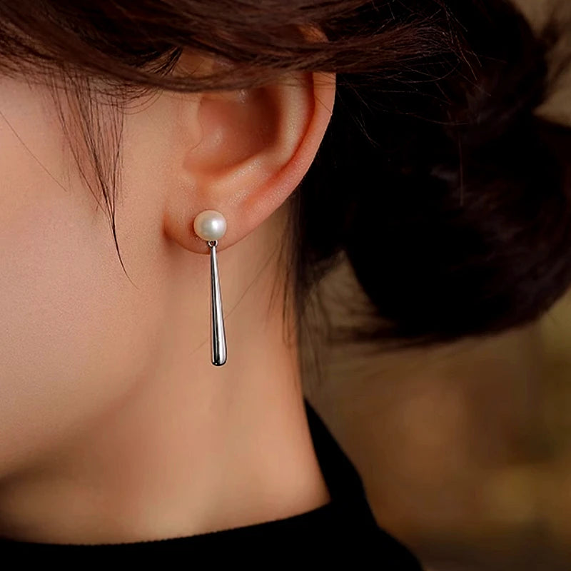 Close-up detail of the sparkling zircons and plating on the Pearl Drop Earrings