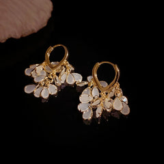 Model showcasing the dangle and style of the 14K Gold-Plated Elegant Water Drop Tassel Earrings