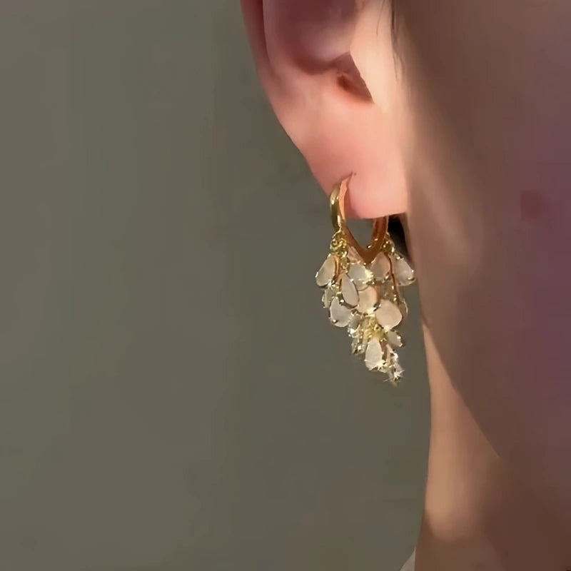 Angled view of the 14K Gold-Plated Elegant Water Drop Tassel Earrings