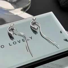 Close-up detail of the sparkling zircons and plating on the Tassel Drop Earrings