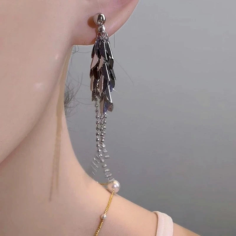 Model showcasing the dangle and style of the 14K Gold-Plated Elegant Wheat Tassel Earrings