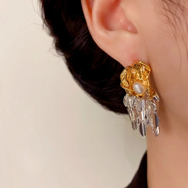 Model showcasing the dangle and style of the 14K Gold-Plated Elegant Wheat Tassel Earrings