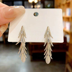 Angled view of the 14K Gold-Plated Elegant Wheat Tassel Earrings