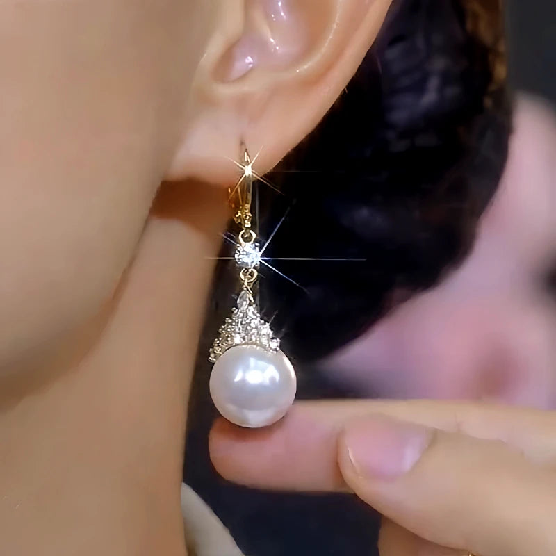 Close-up detail of the sparkling zircons and plating on the Crown Pearl Earrings