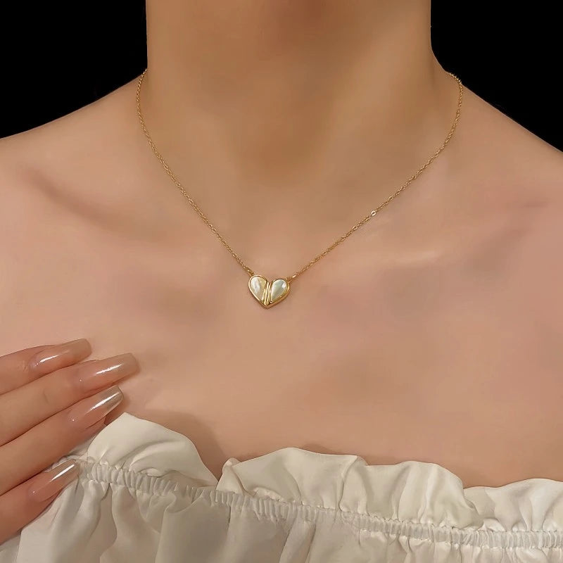 Detailed view of the 14K Gold-Plated Elegant White Shell Heart Magnetic Necklace chain and pendant