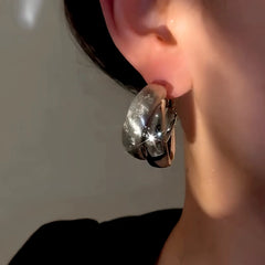 Close-up detail of the sparkling zircons and plating on the Wide Hoop Earrings