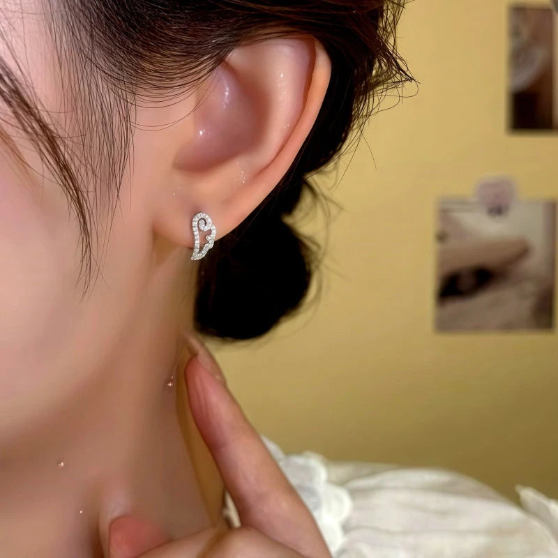 Close-up detail of the sparkling zircons and plating on the Angel Wing Hoops