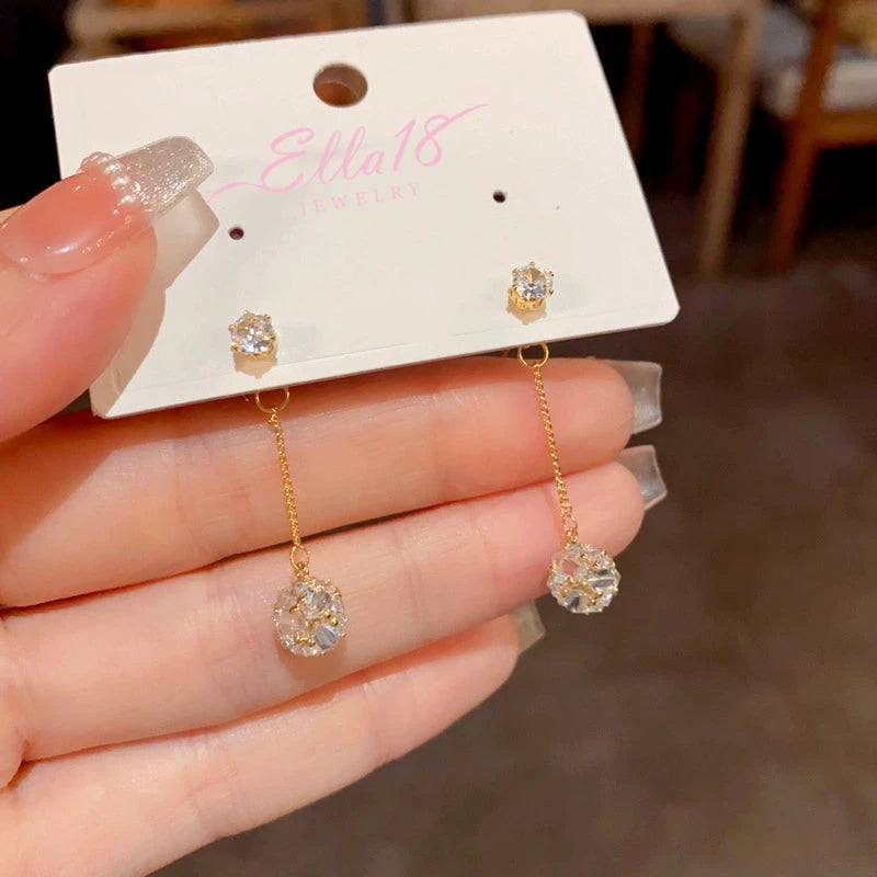 Angled view of the 14K Gold-Plated Elegant Zircon Ball Tassel Earrings