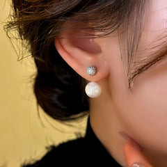 Model showcasing the dangle and style of the 14K Gold-Plated Elegant Zircon Bead Earrings