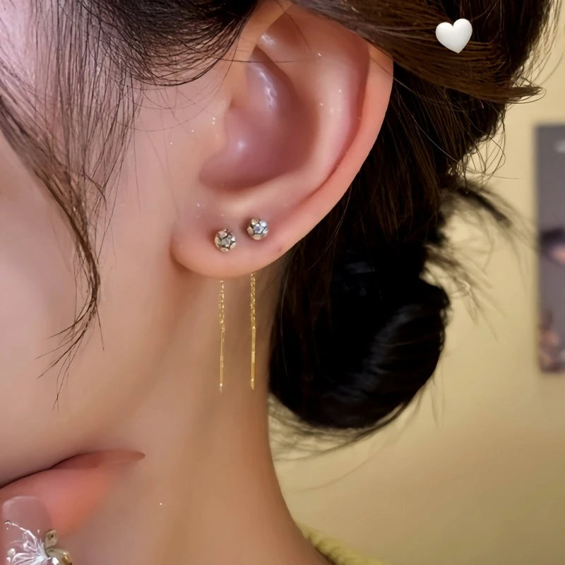 Model showcasing the dangle and style of the 14K Gold-Plated Elegant Zircon Bean Threader Earrings