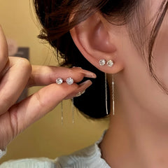 Model showcasing the dangle and style of the 14K Gold-Plated Elegant Zircon Bean Threader Earrings