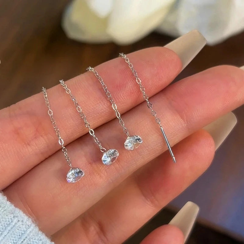 Angled view of the 14K Gold-Plated Elegant Zircon Bean Threader Earrings