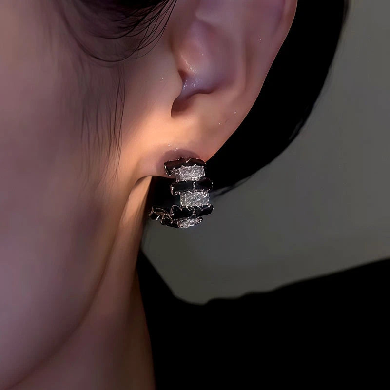 Close-up detail of the sparkling zircons and plating on the Black and White Hoops