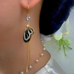 Close-up detail of the sparkling zircons and plating on the Butterfly Ear Hooks