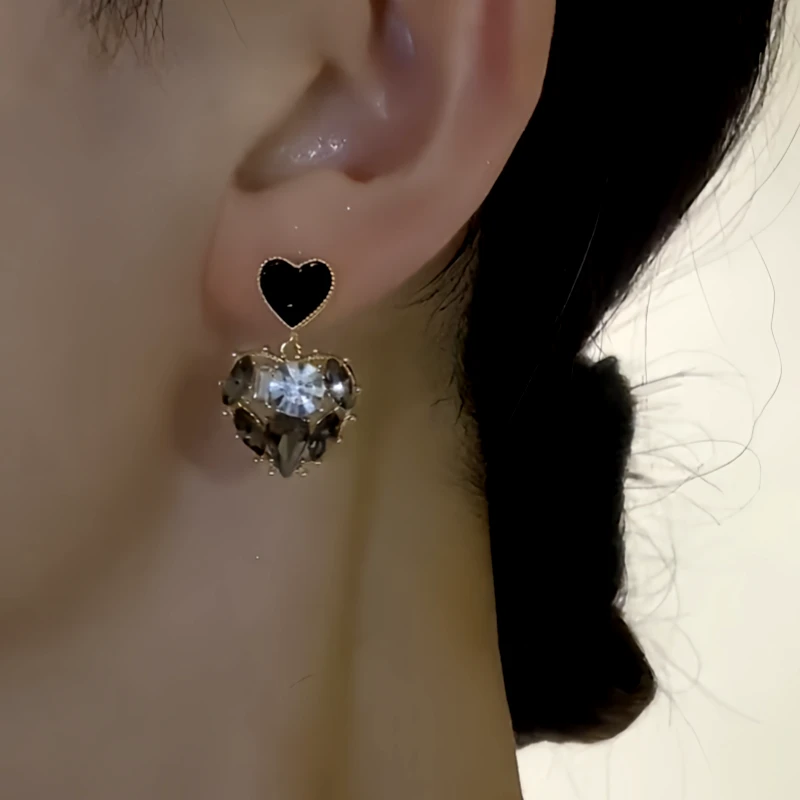 Close-up detail of the sparkling zircons and plating on the Black Heart Earrings