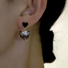 Close-up detail of the sparkling zircons and plating on the Black Heart Earrings