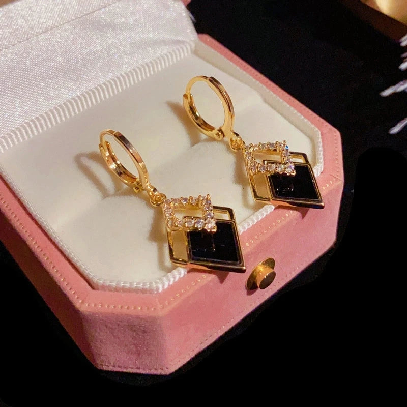 Angled view of the 14K Gold-Plated Elegant Zircon Black Double Diamond Earrings