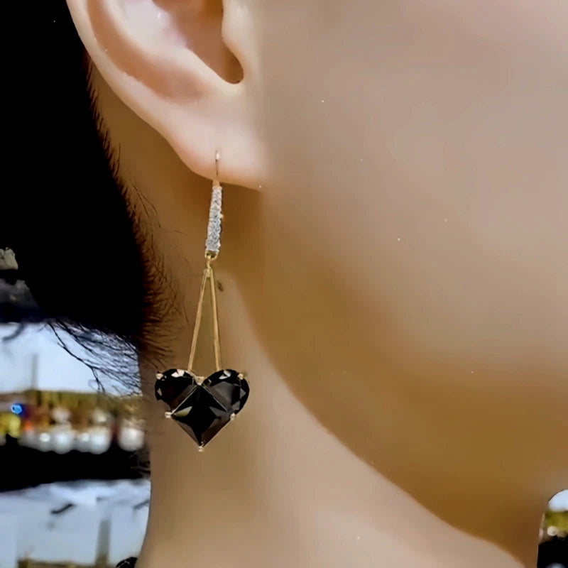 Close-up detail of the sparkling zircons and plating on the Heart Ear Hooks