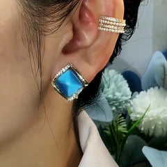 Close-up detail of the sparkling zircons and plating on the Blue Cat's Eye Studs