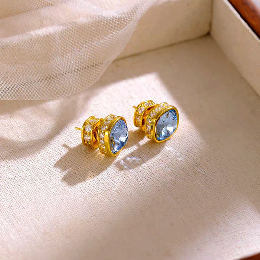 Model showcasing the dangle and style of the 14K Gold-Plated Elegant Zircon Blue Diamond Stud Earrings