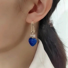 Close-up detail of the sparkling zircons and plating on the Blue Heart Earrings