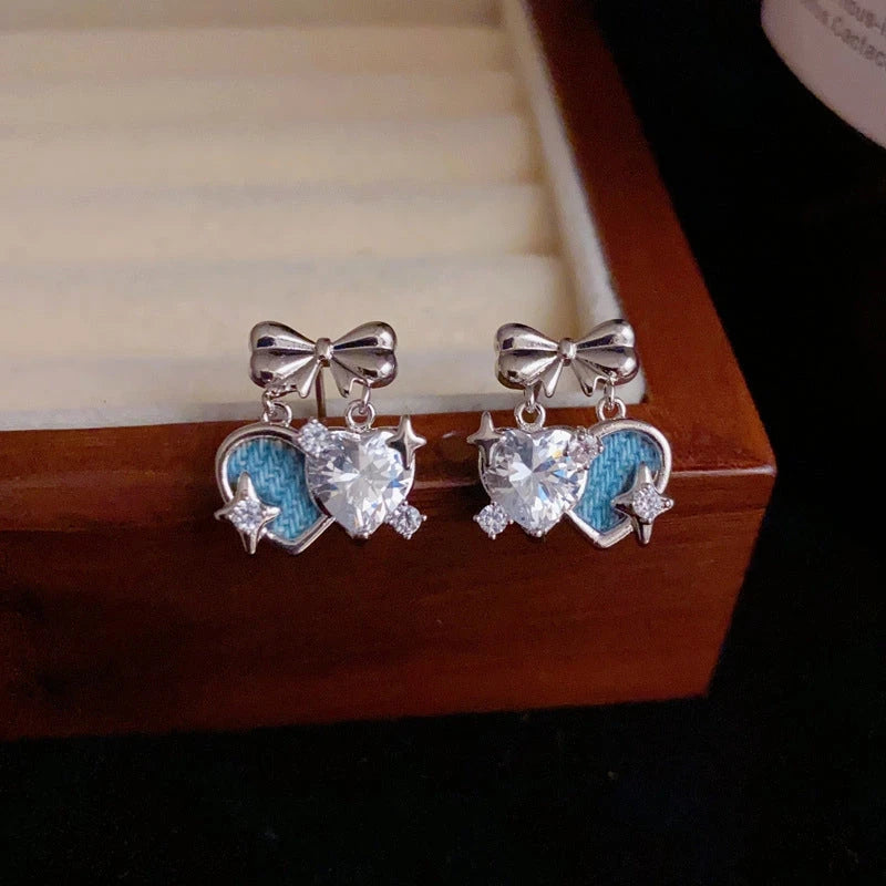 Close-up detail of the sparkling zircons and plating on the Double Heart Earrings