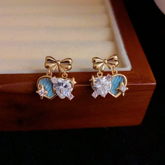 Angled view of the 14K Gold-Plated Elegant Zircon Bow Double Heart Earrings
